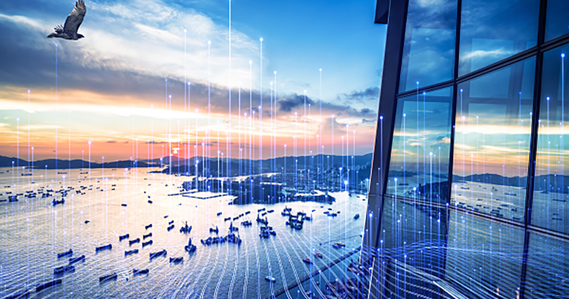 Aerial view of a sea coast in the evening overlaid with graphics of transmission of nodes